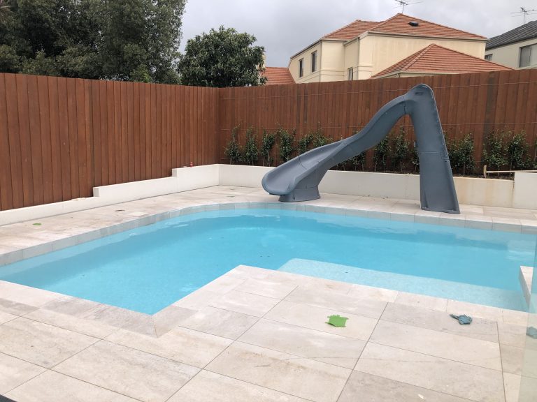 Residential swimming pool with SR Smith pool slide